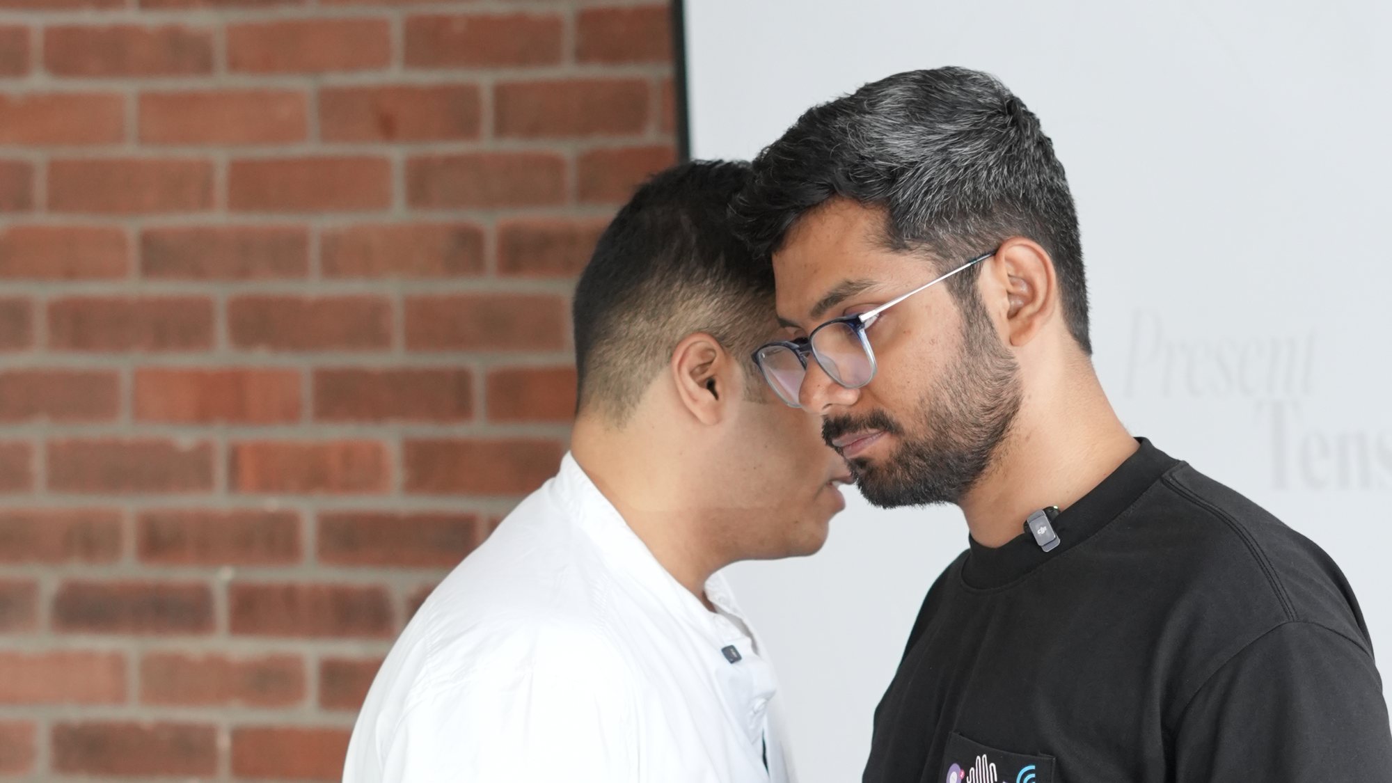 Yash and Praveen conferring between exercises.
